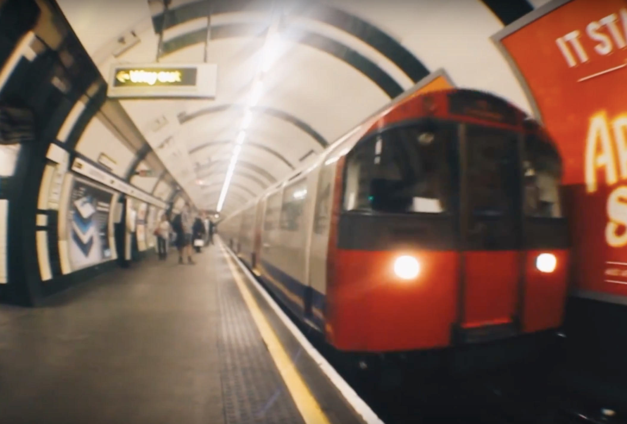 London Underground train arriving at a station.